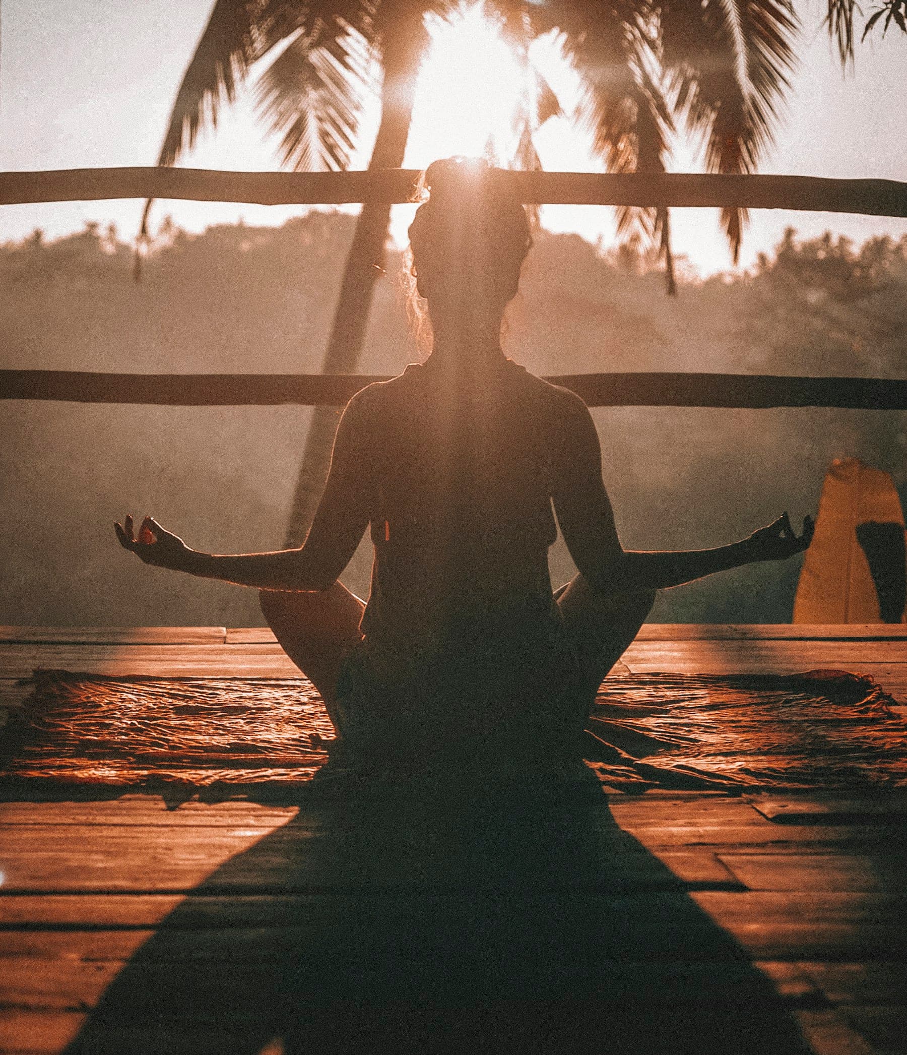 A person practising yoga in a quiet indoor space.